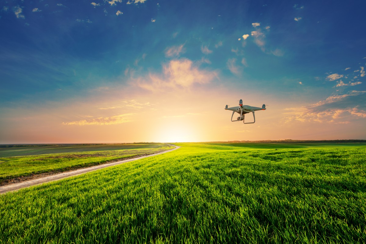 drone flies over farm field 203172701