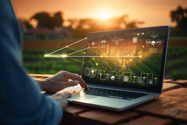 farmer used laptop to leverage data and AI for agriculture 641211737